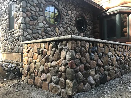 A cabin near Ely, MN with exterior rock work done by Rock Country Masonry.
